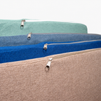 Close-up of zippers on removable orthopedic dog bed covers in four colours
