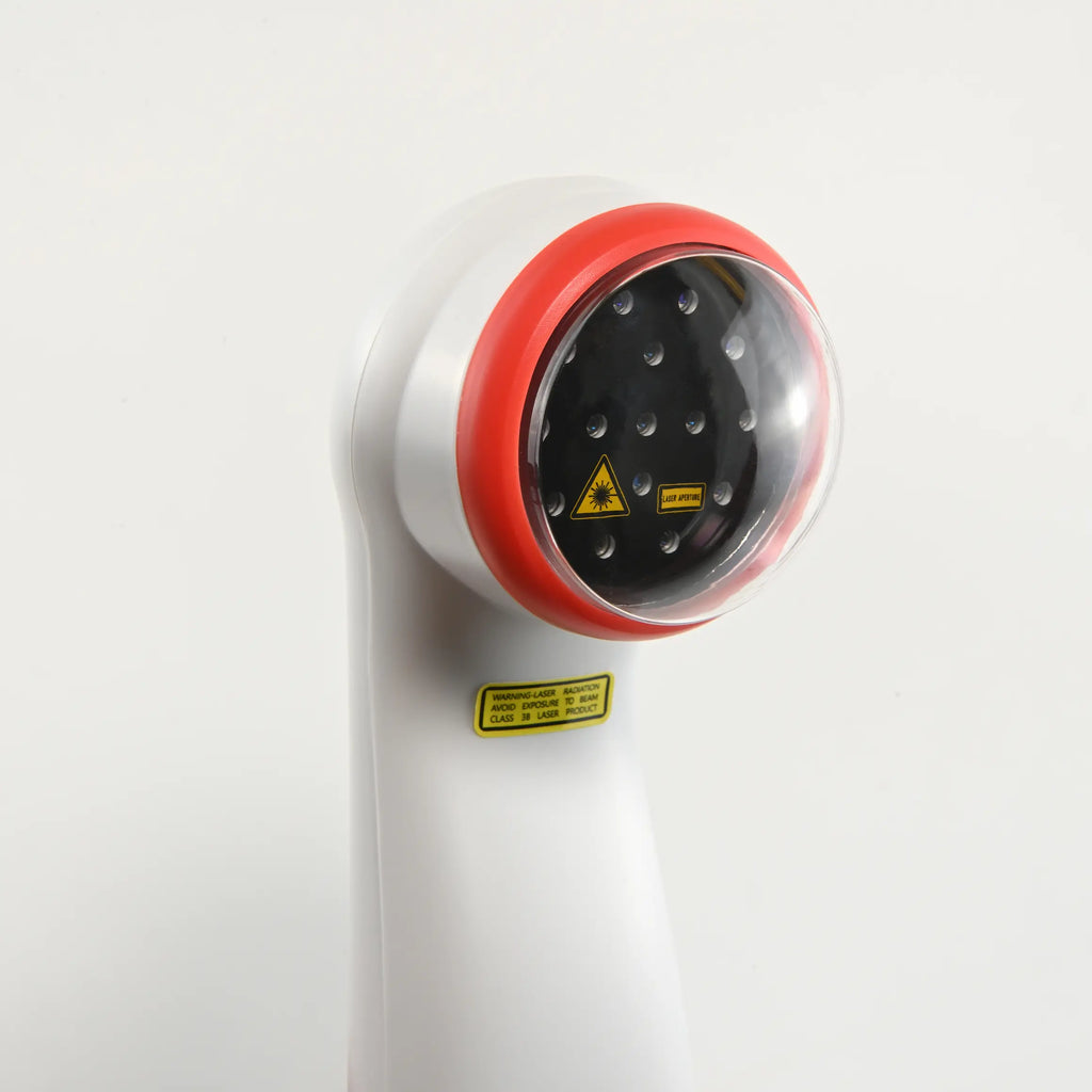 Close-up of the laser therapy device head with diodes and safety label